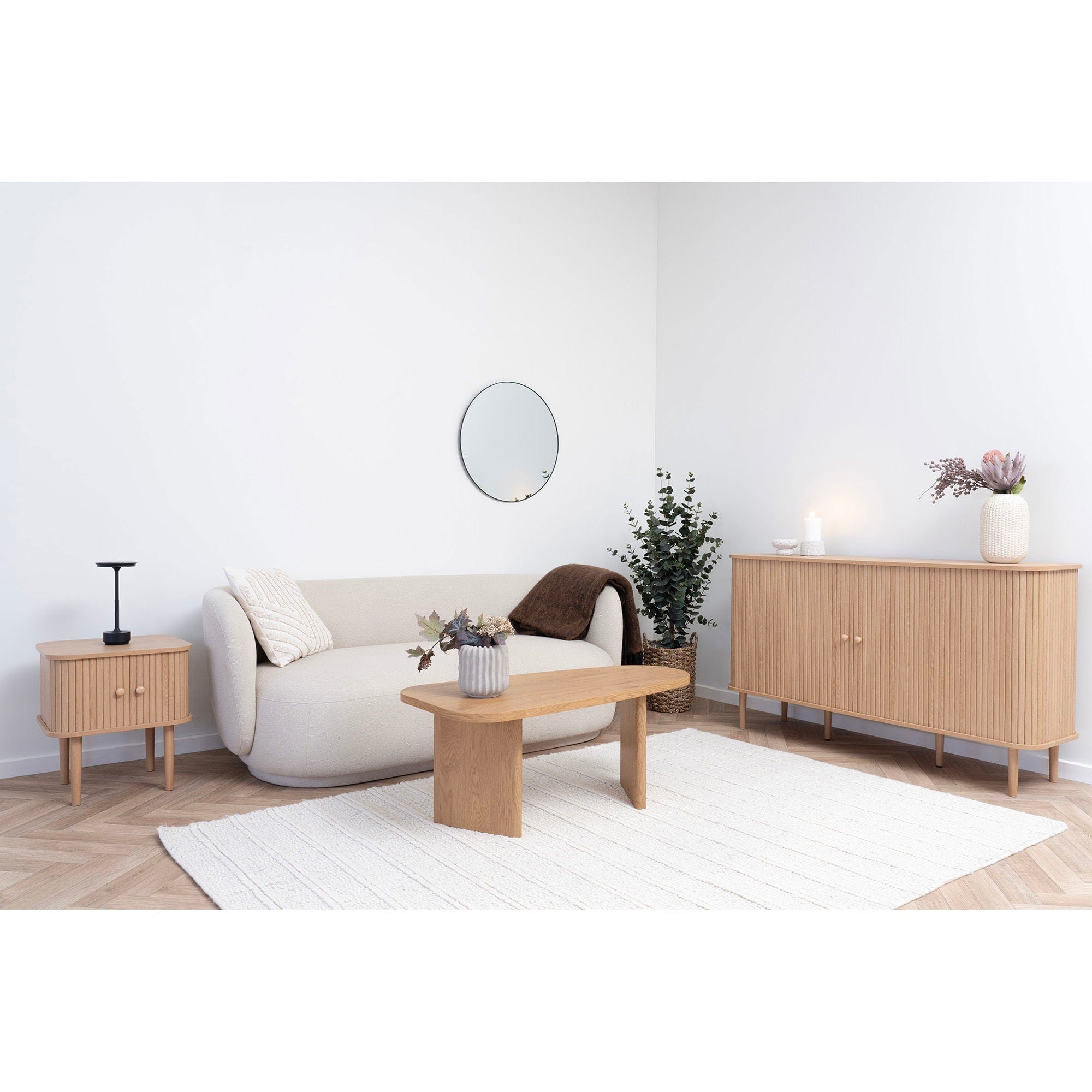 Modern living room with wooden furniture and white walls