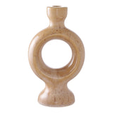 Brown ceramic candle holder with sculptural shape .