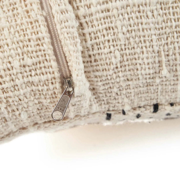 Close-up of a textured fabric surface with a zipper