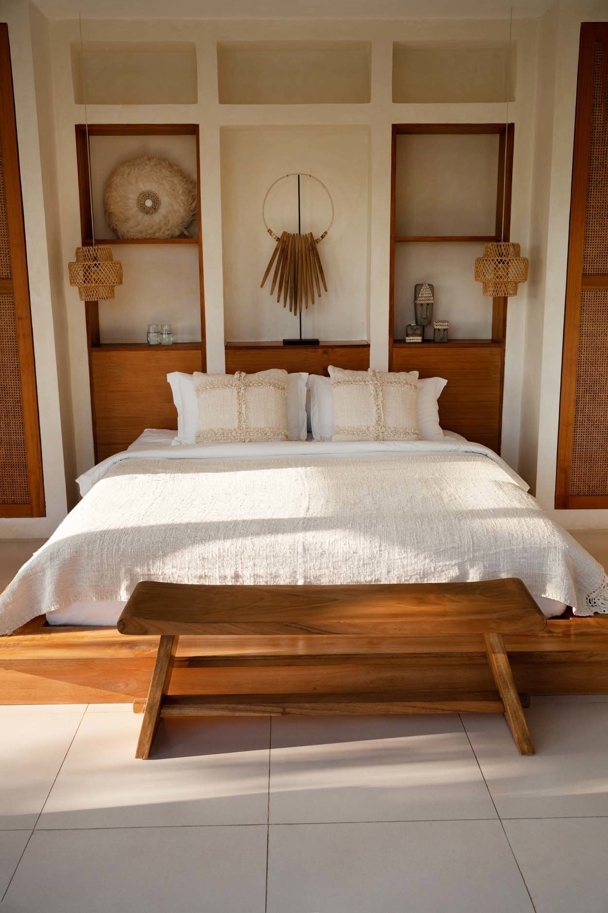 Bedroom with wooden bench and decorative elements