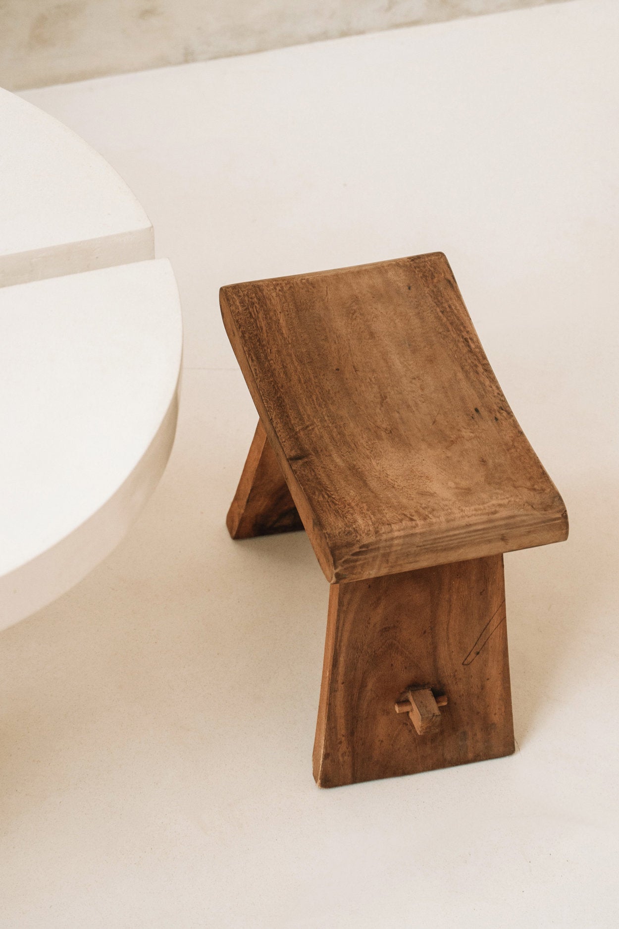 Wooden stool on a light-colored floor