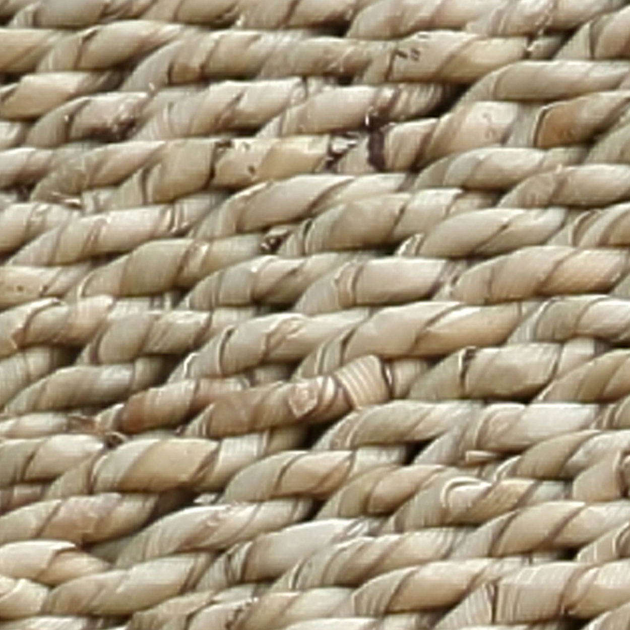 Close-up of woven straw matting with a beige color.