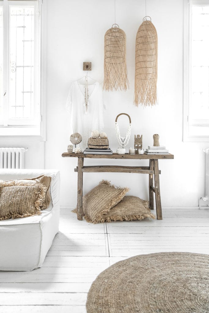 Squid Pendant Lamp in natural rattan hanging in a minimalist, boho-style room.