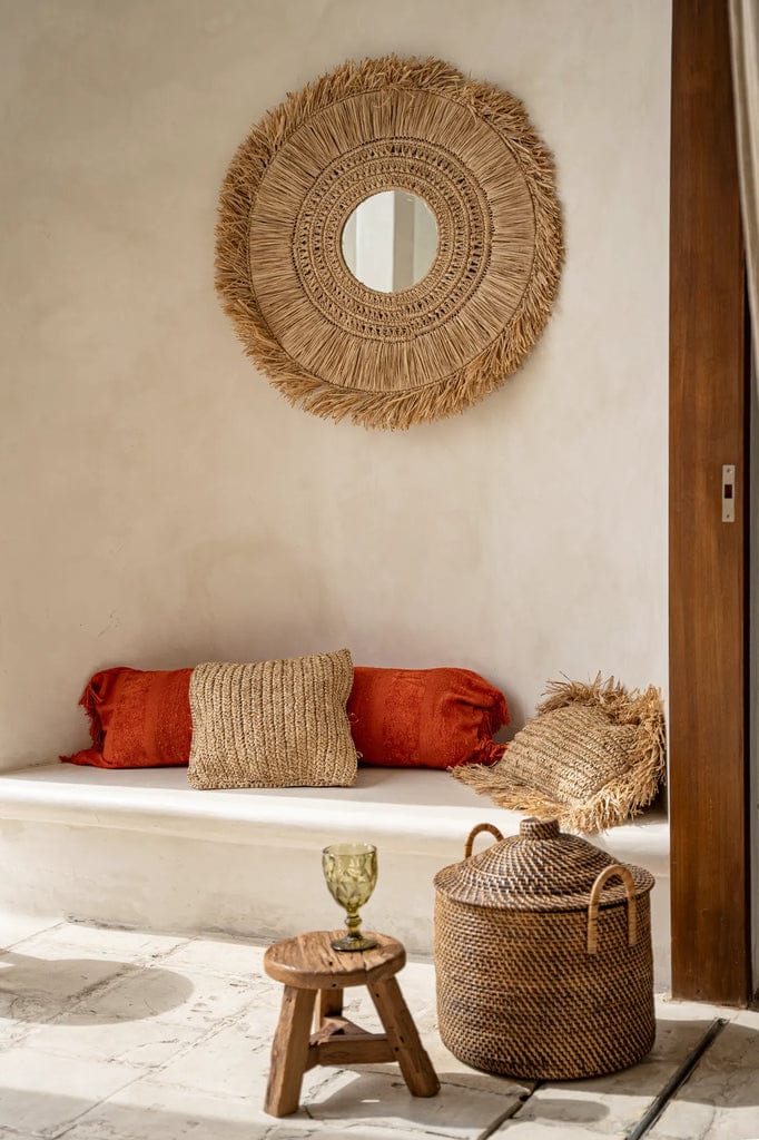 "Handcrafted Yuki mirror with natural raffia weaves in a unique five-ring design, perfect for coastal-inspired interiors"