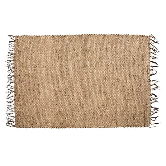 "XL Field Seagrass rug: Handwoven water hyacinth, fringe edges. Earthy tone for a natural ambiance."