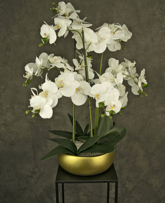 "Image: Lifelike Artificial Orchid in a gold bowl, perfect for elegant home or office decor."