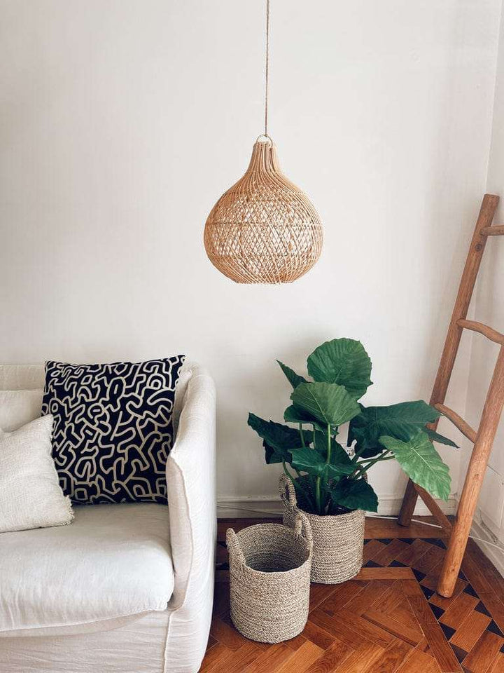 Mandala Round Rattan Lampshade with Natural Cross Design in bohemian living room.