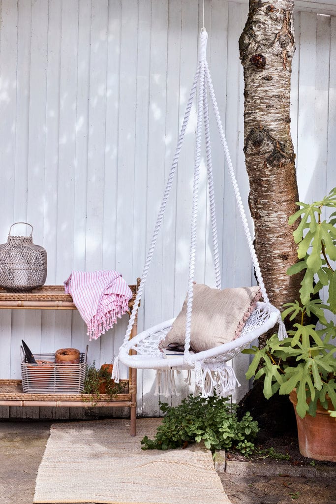 Oville Cushion 50x50 cm Dark Linen with tassels, enhancing outdoor swing chair.