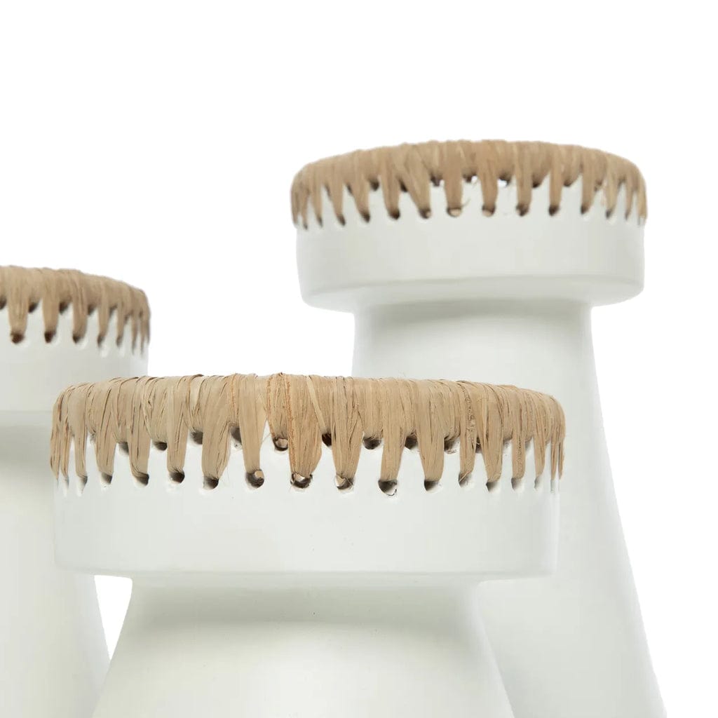 White terracotta candle holder with raffia accent, elegant home decor accessory.