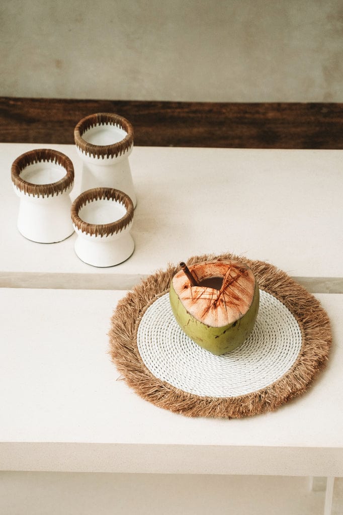 Pretty candle holder in white terracotta with raffia accent, small size, natural and stylish decor piece.