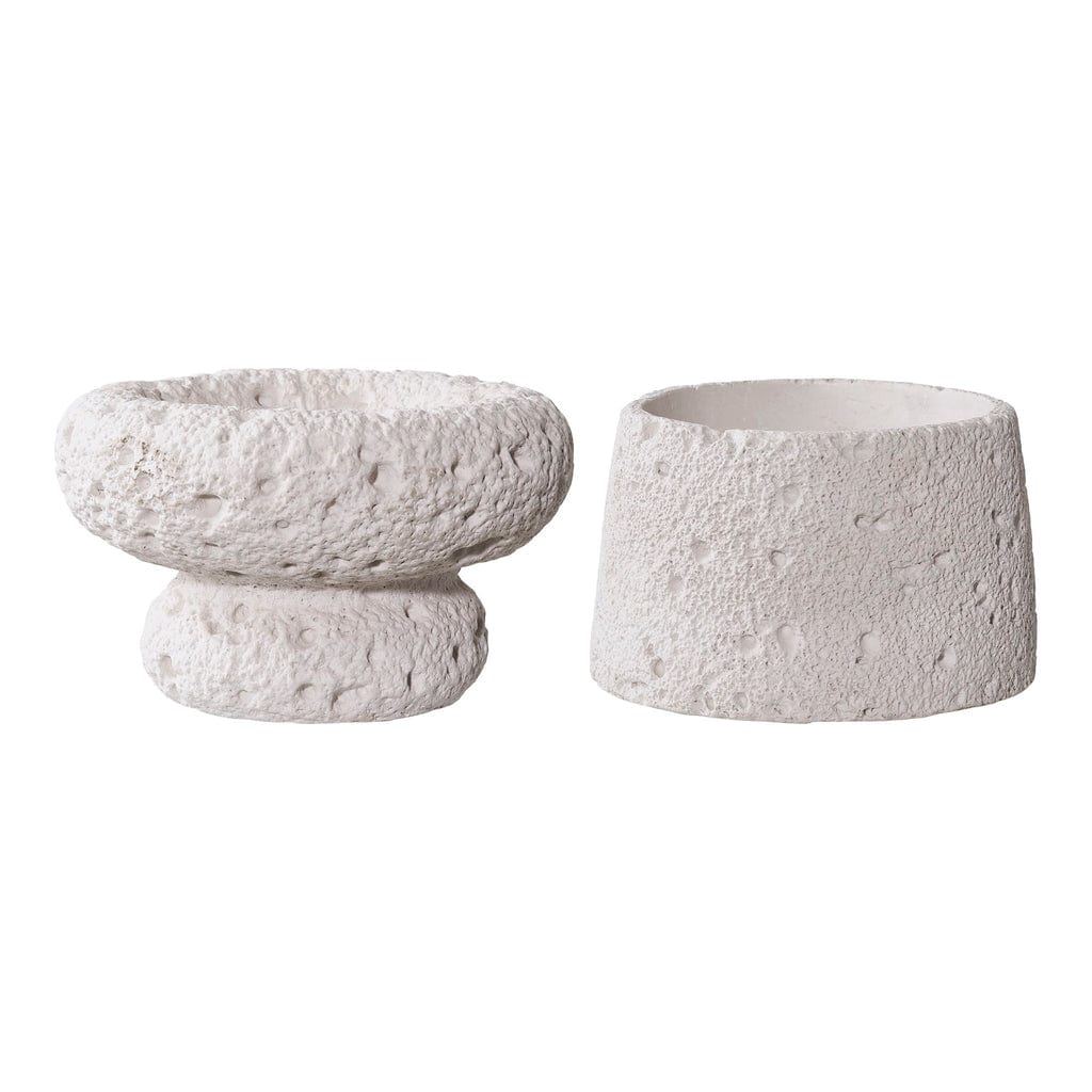 Two textured ceramic bowls on a white background