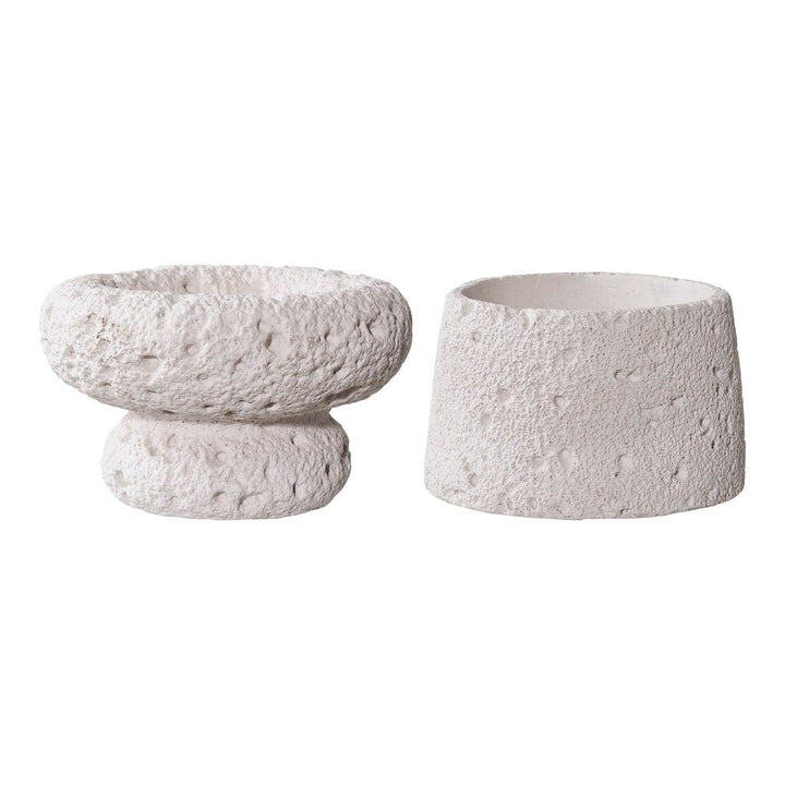 Two textured ceramic bowls on a white background