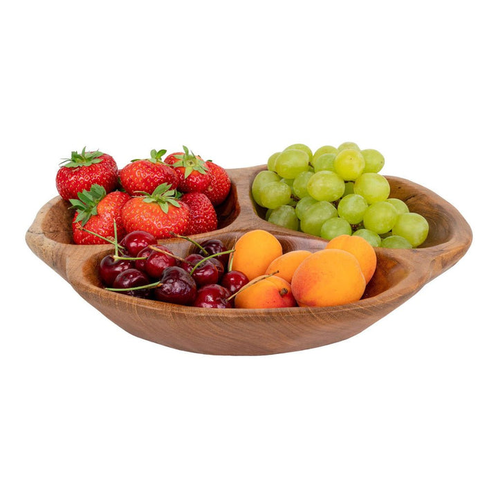 Wooden fruit bowl with strawberries, grapes, cherries, and apricots on a white background