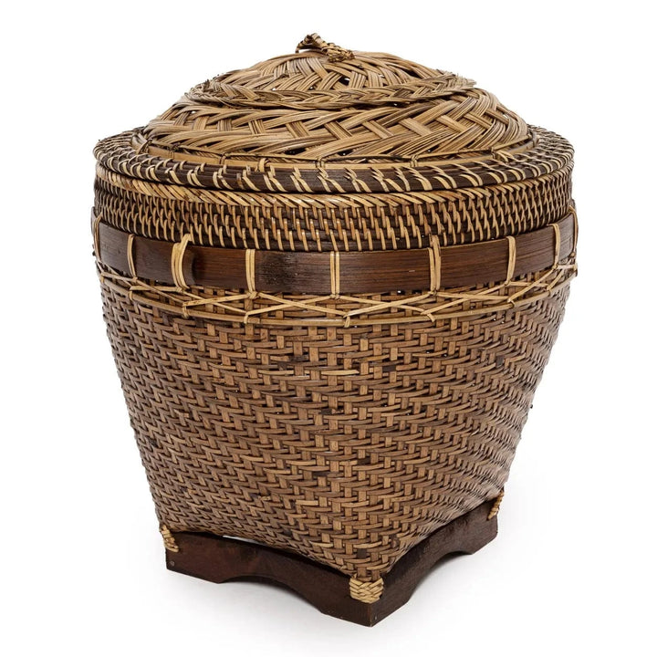 Woven basket with a lid on a white background