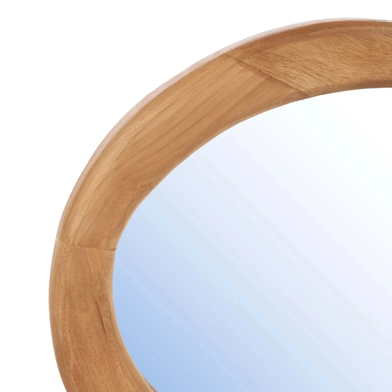 Round wooden mirror with a light blue gradient background