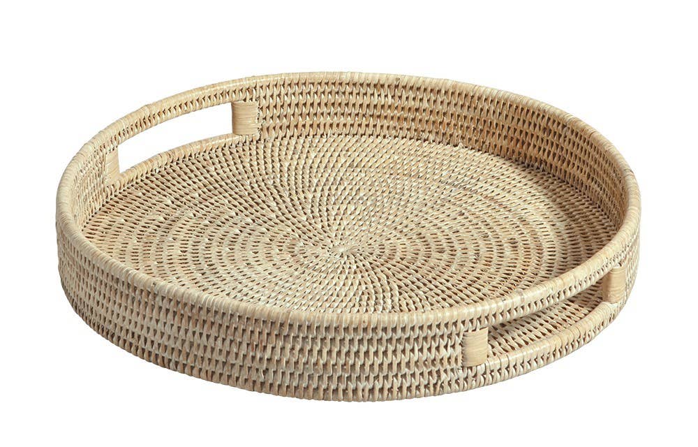 Woven rattan tray with handles on a white background