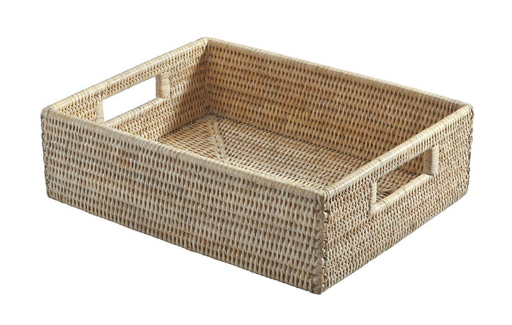 Woven rattan tray with handles on a white background
