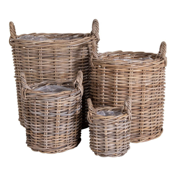 Set of four wicker baskets with handles on a white background