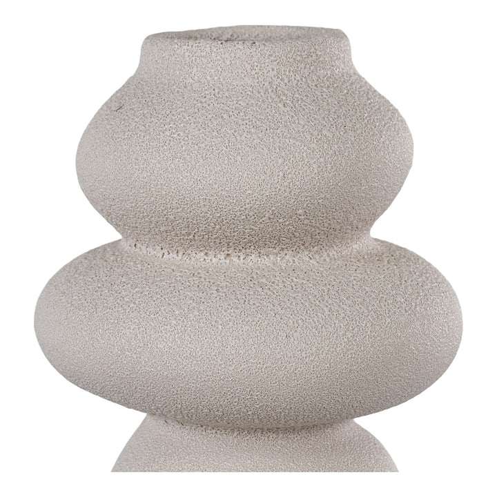 Textured ceramic vase on a white background