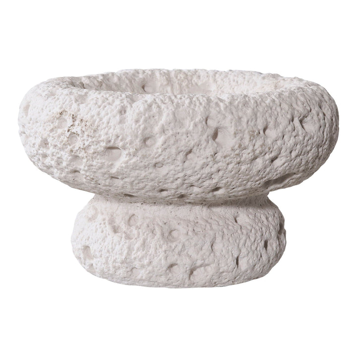 Textured stone bowl on a white background