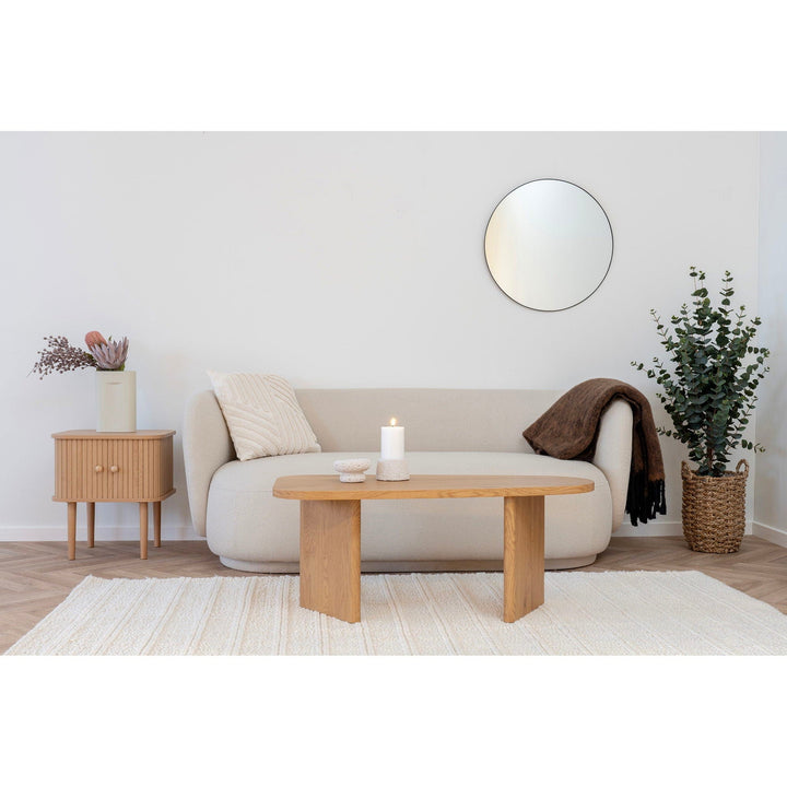 Modern living room with a sofa, coffee table, and decor