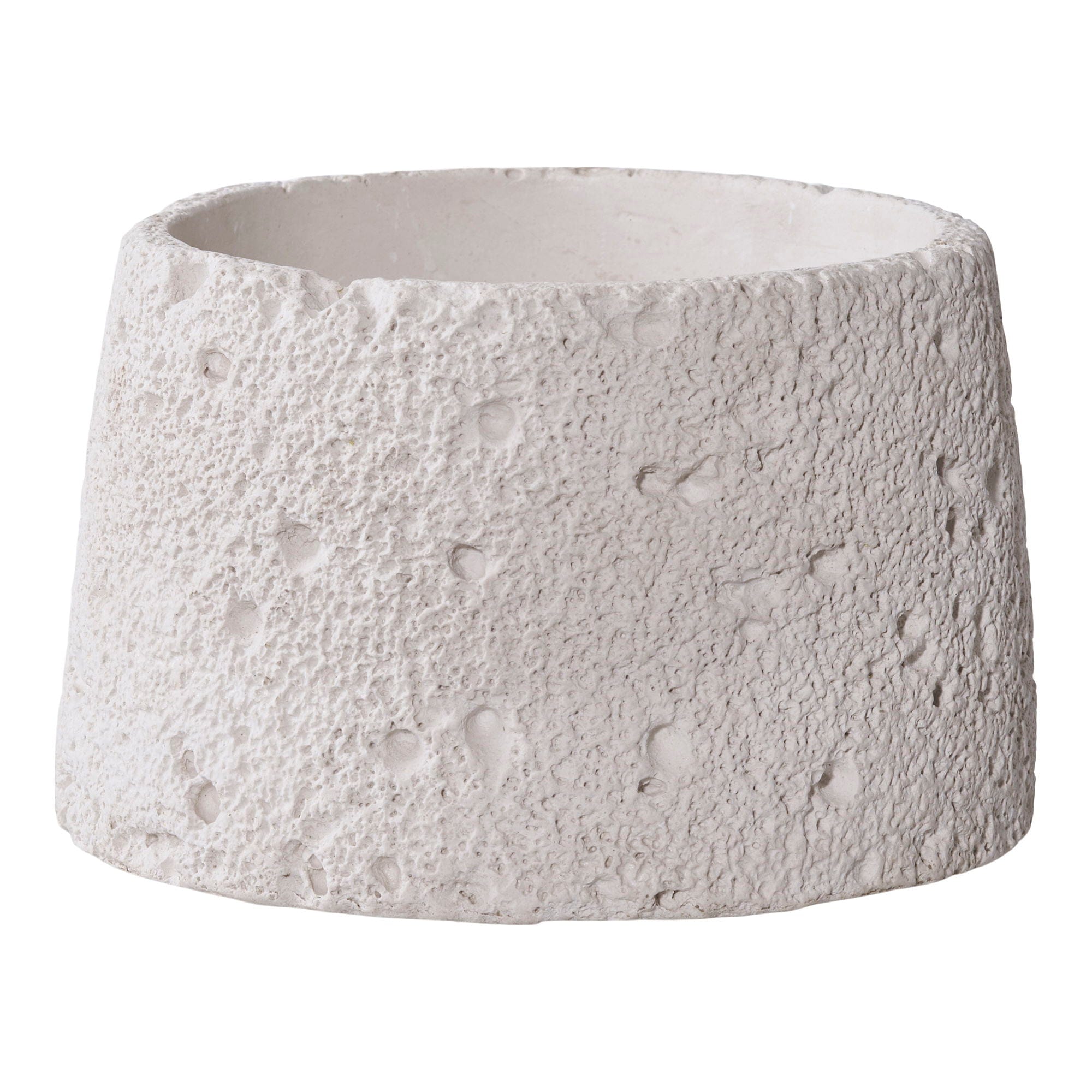 Textured white ceramic planter on a plain background