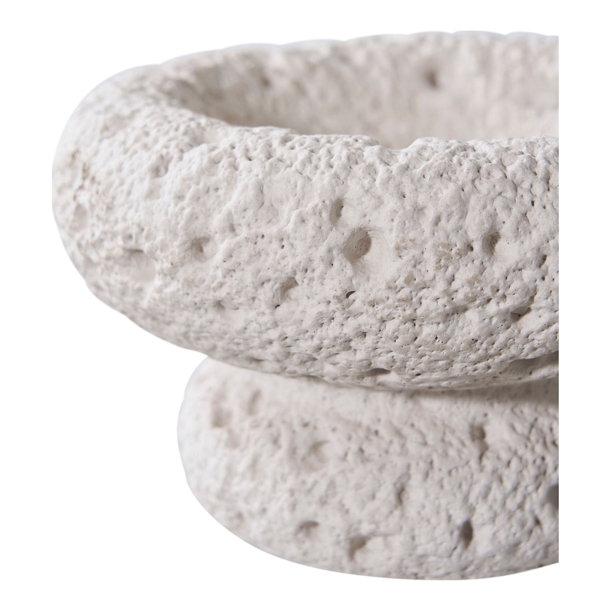 Textured stone bowl on a white background