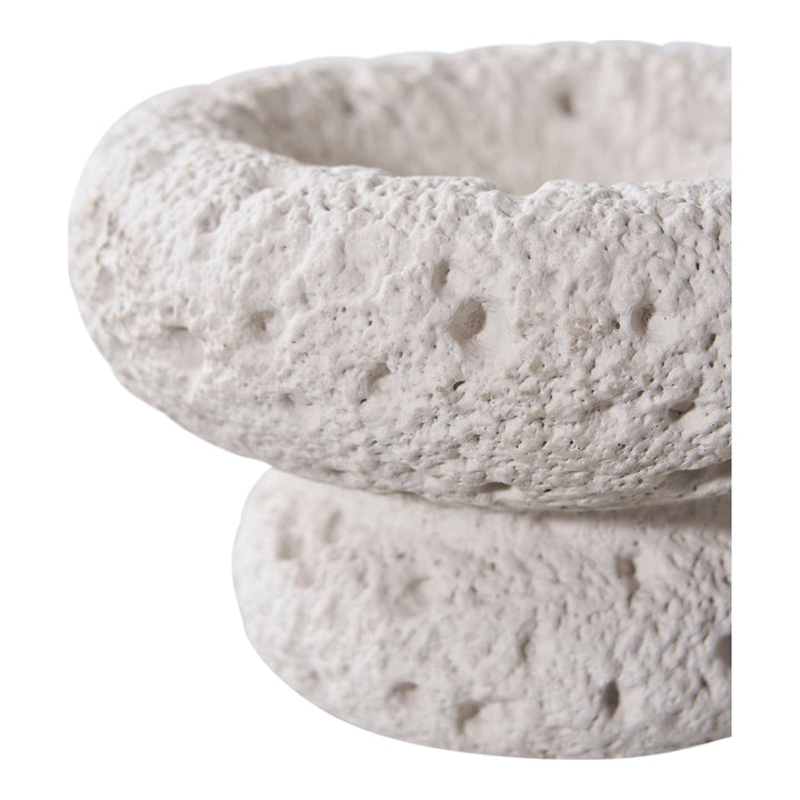 Textured stone bowl on a white background