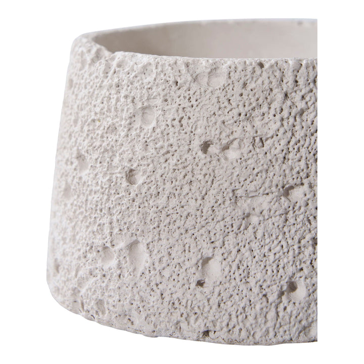 Textured ceramic planter on a white background