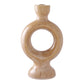 Brown ceramic candle holder with sculptural shape .