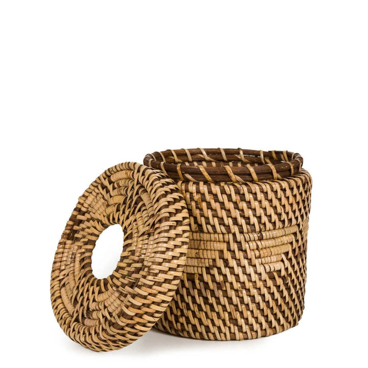 Woven basket with a lid on a white background
