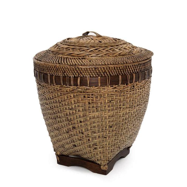Woven basket with a lid on a white background