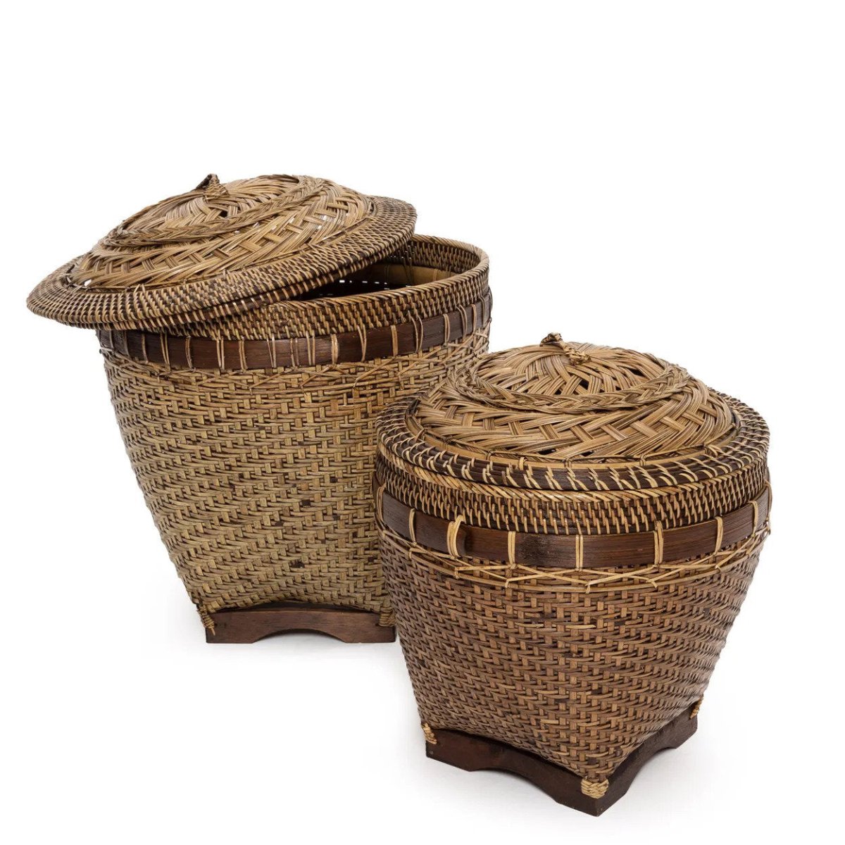 Two woven baskets with lids on a white background