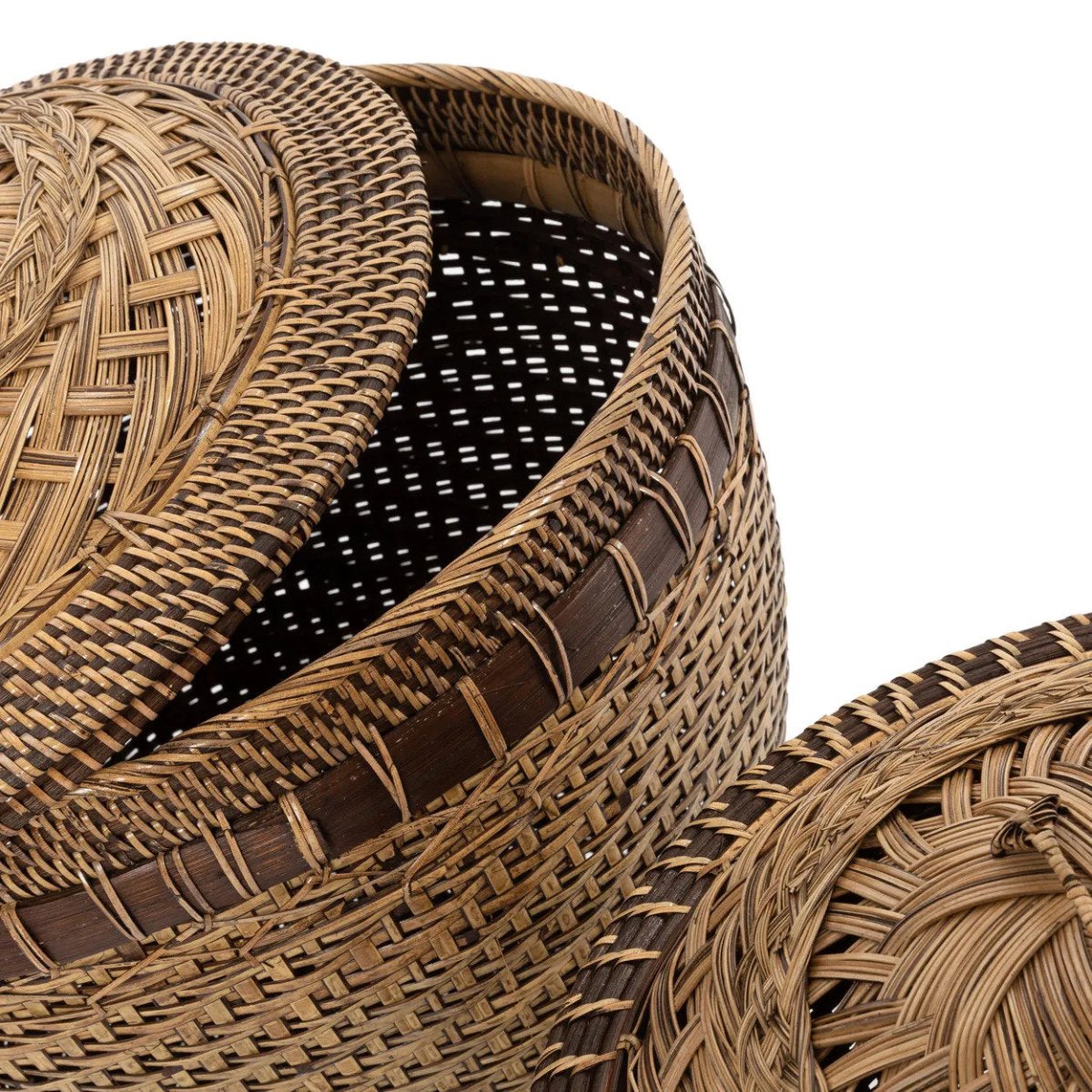 Close-up of a woven basket with a lid on a white background