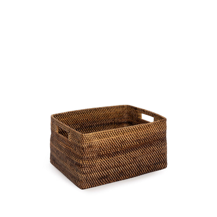 Woven brown storage basket on a white background
