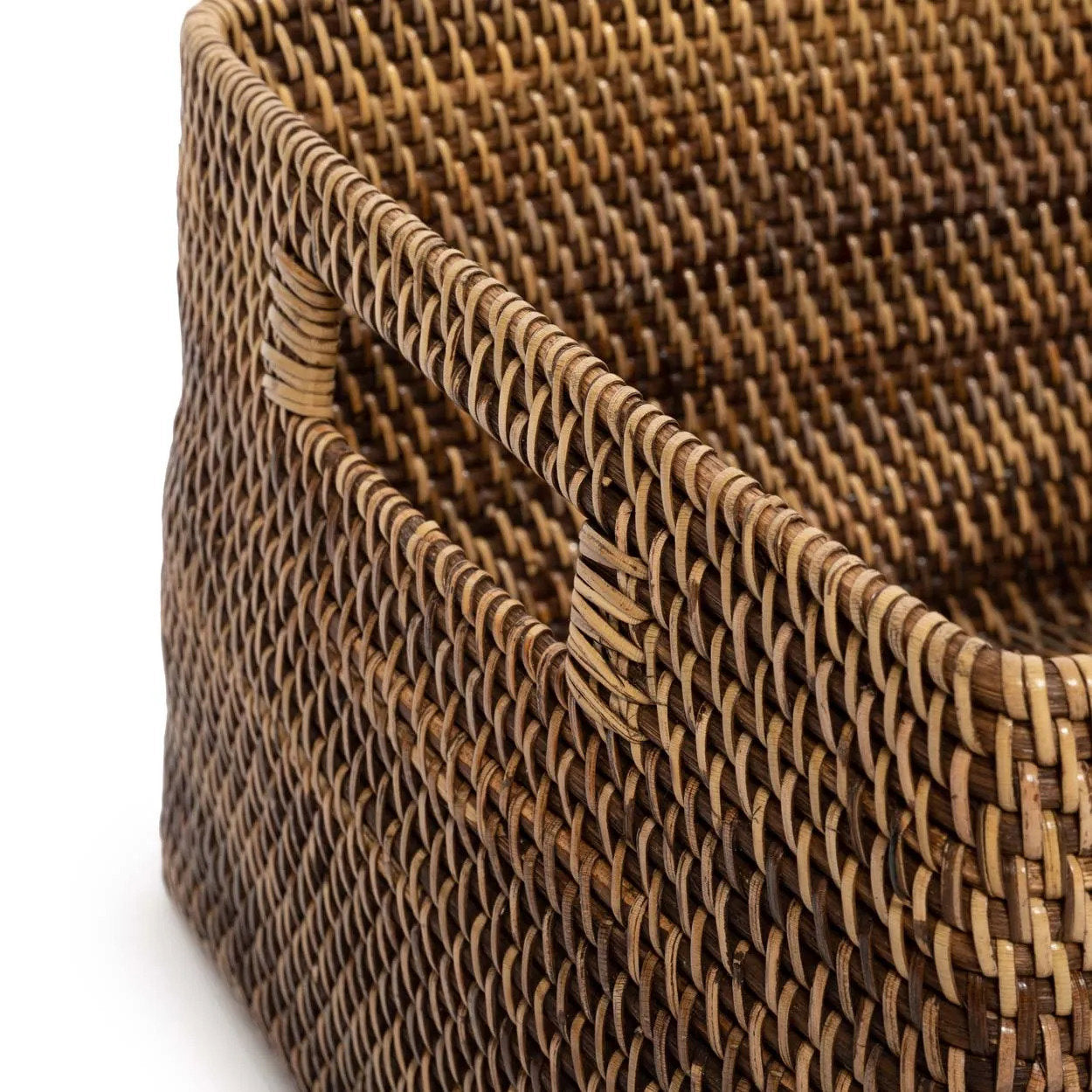 Close-up of a woven brown basket with a white background