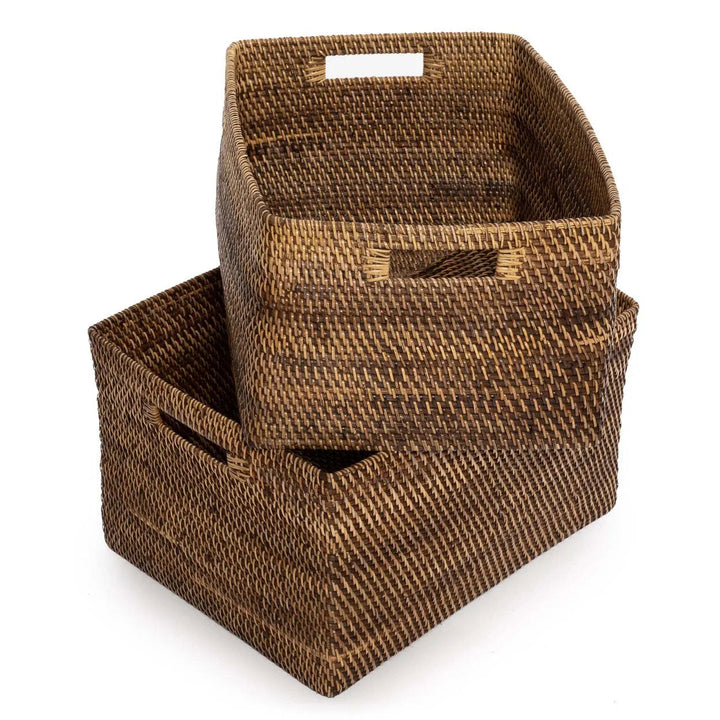 Two woven brown storage baskets on a white background