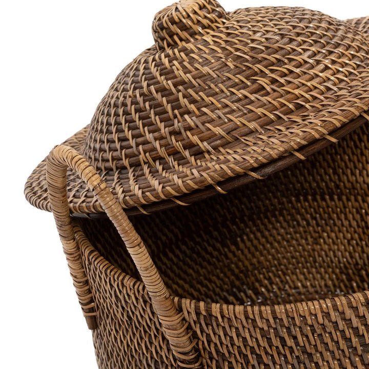 Wicker laundry basket with lid on a white background