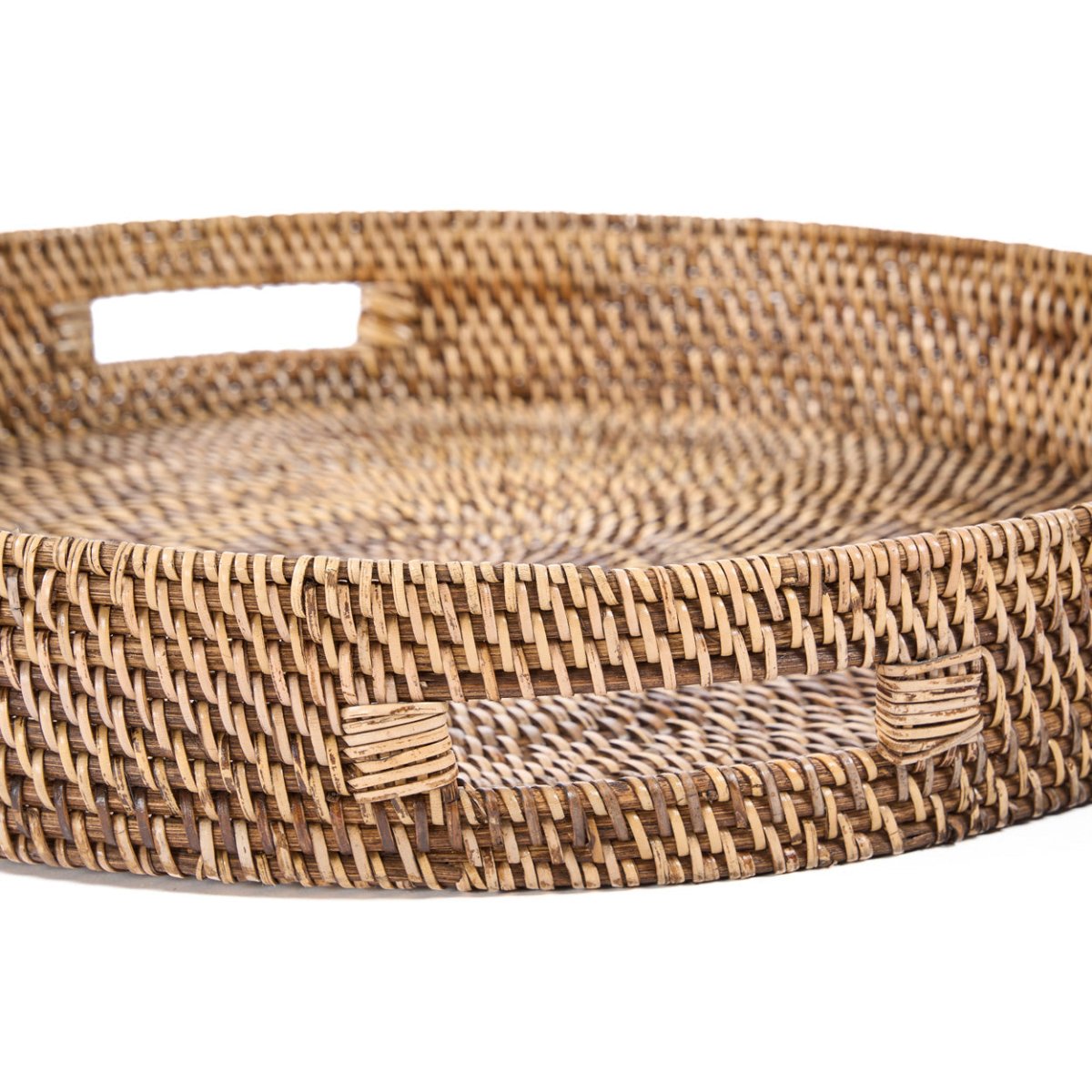 Woven rattan tray on a white background