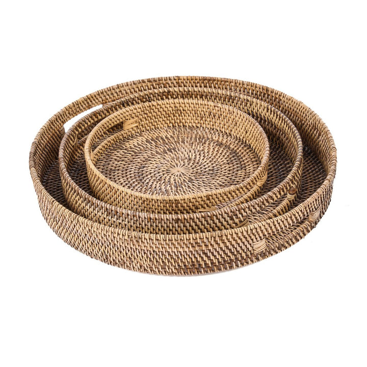 Set of three woven baskets on a white background