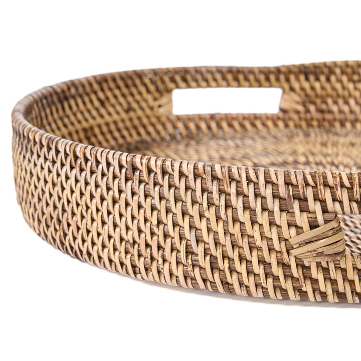 Woven rattan tray with a white background