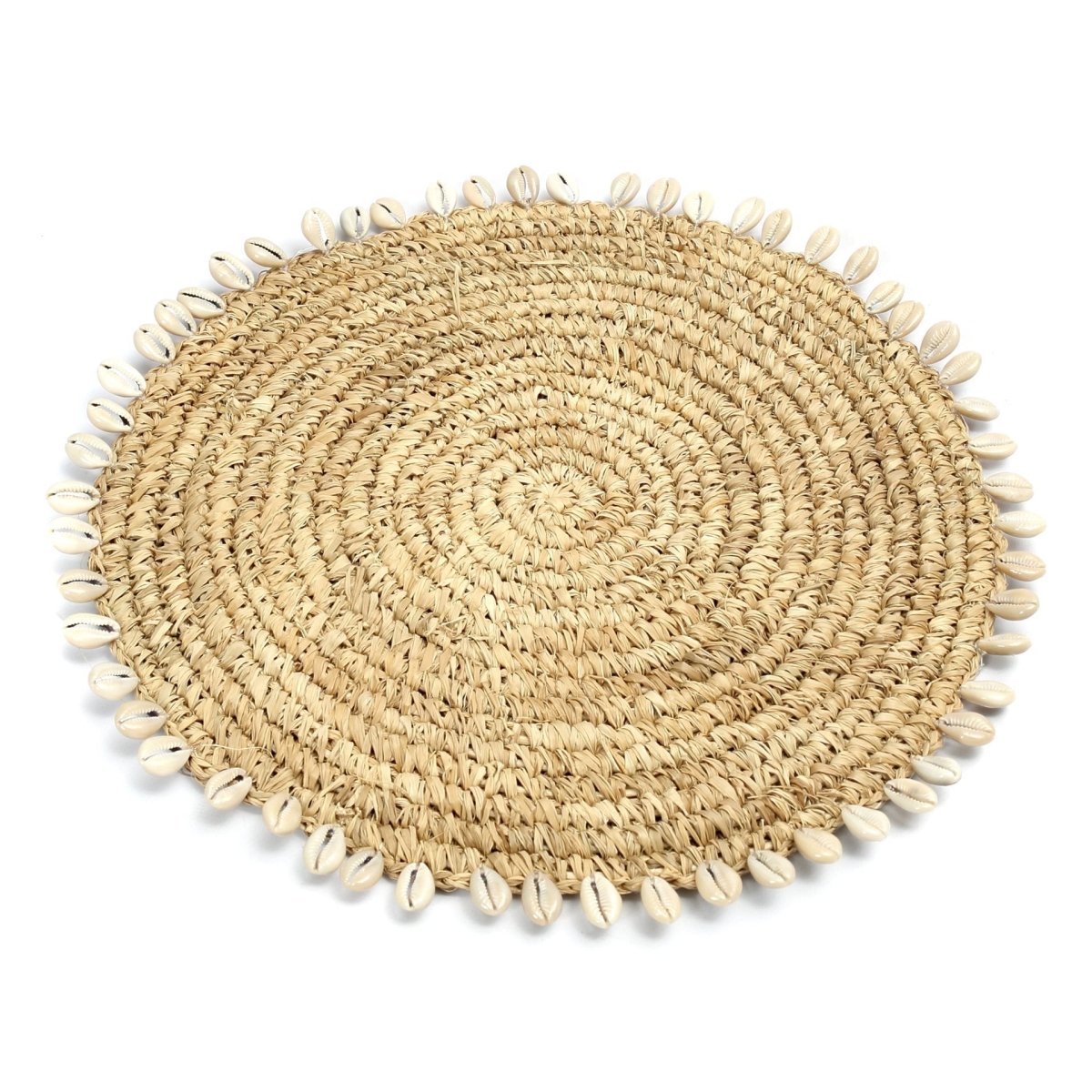 Round woven placemat with shell embellishments on a white background