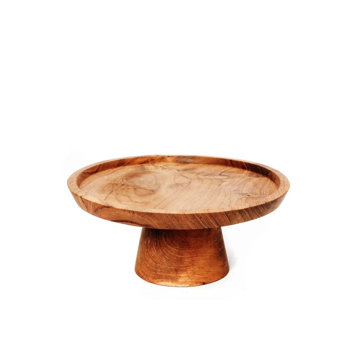 Wooden pedestal dish on a white background