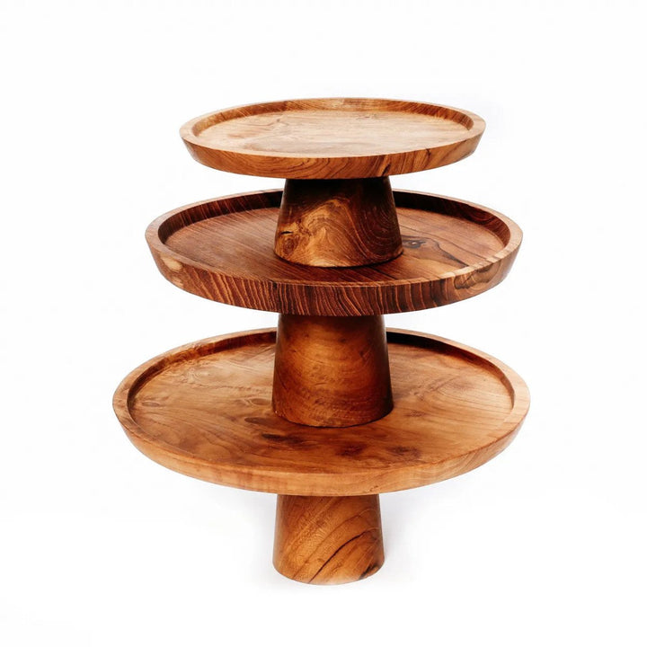 Three-tiered wooden serving tray on a white background