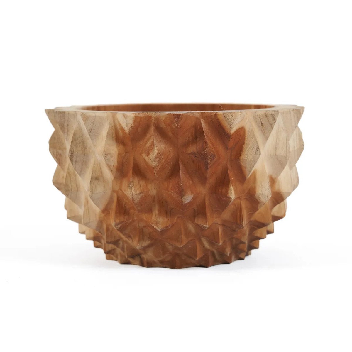 Wooden bowl with textured surface on a white background
