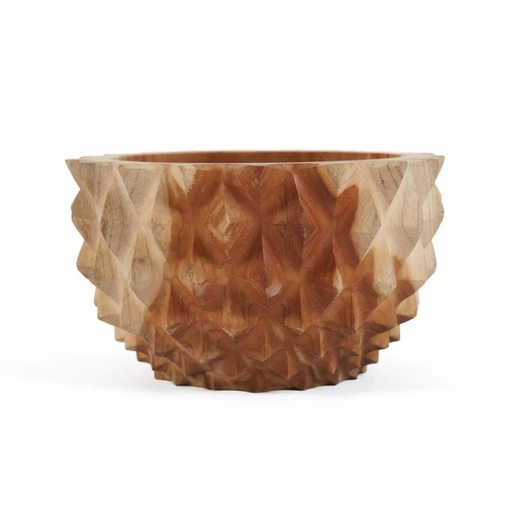 Wooden bowl with textured surface on a white background