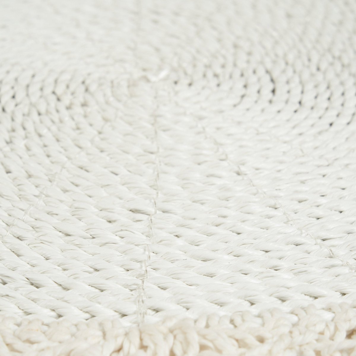Close-up of a textured white fabric surface