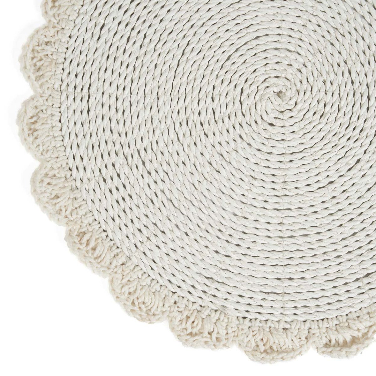 Round woven mat with scalloped edge on a white background