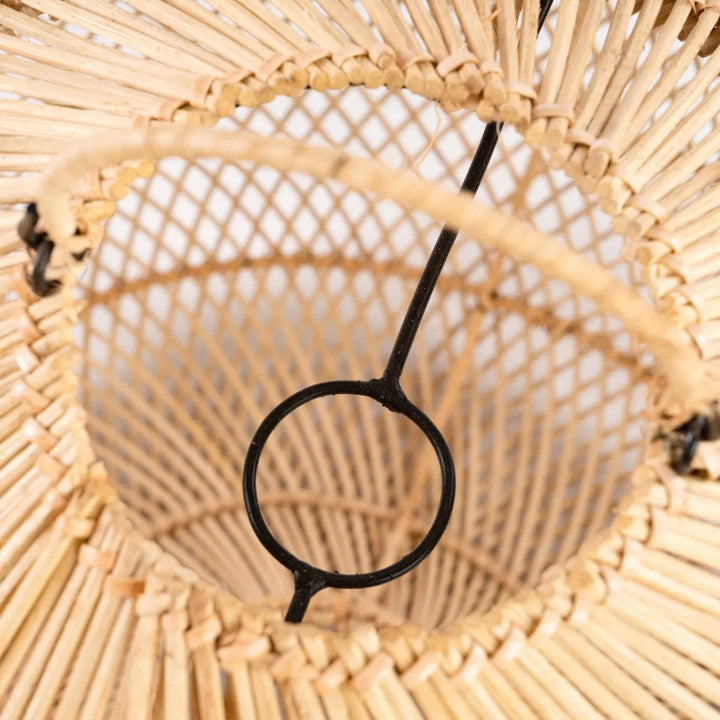 Close-up of a woven basket with a black metal hook inside