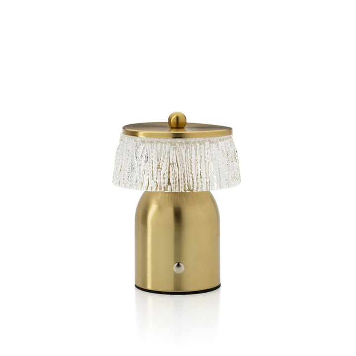 Gold table lamp with textured shade on a white background
